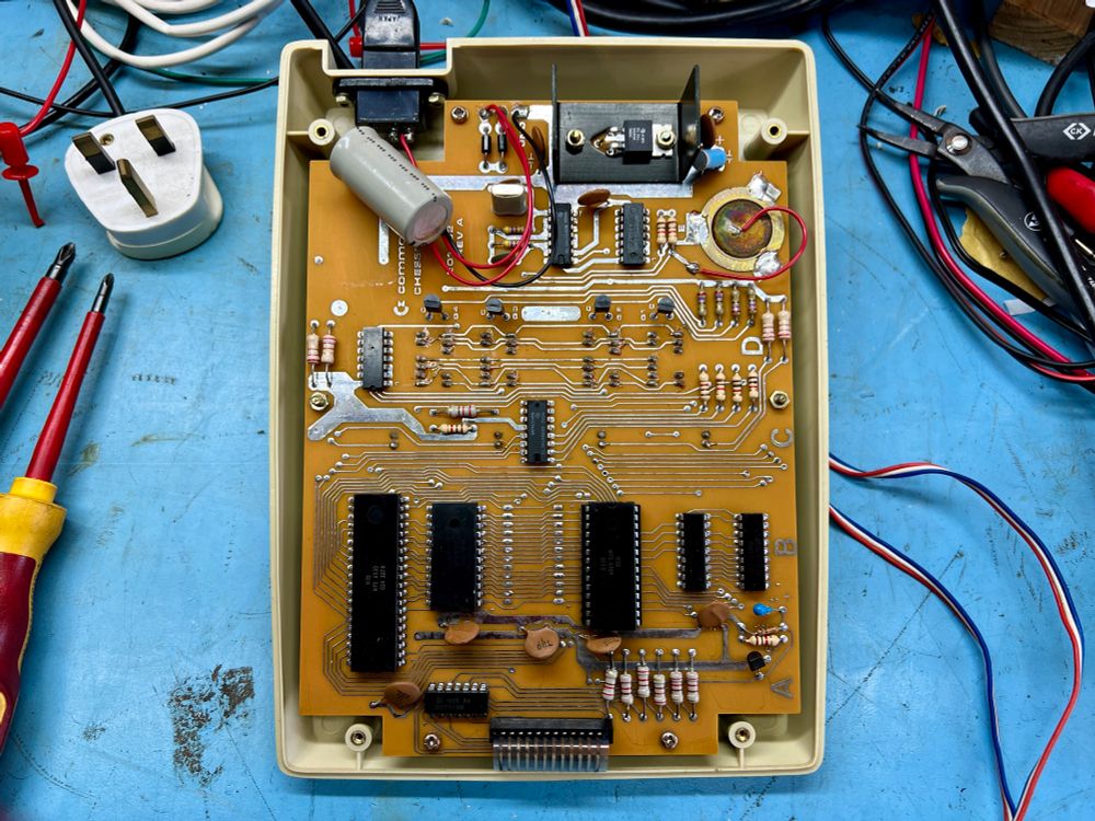 Innards of the CHESSmate, the 6530 CPU is on the left. Lovely brown board with no solder mask, this was 1979 after all. 