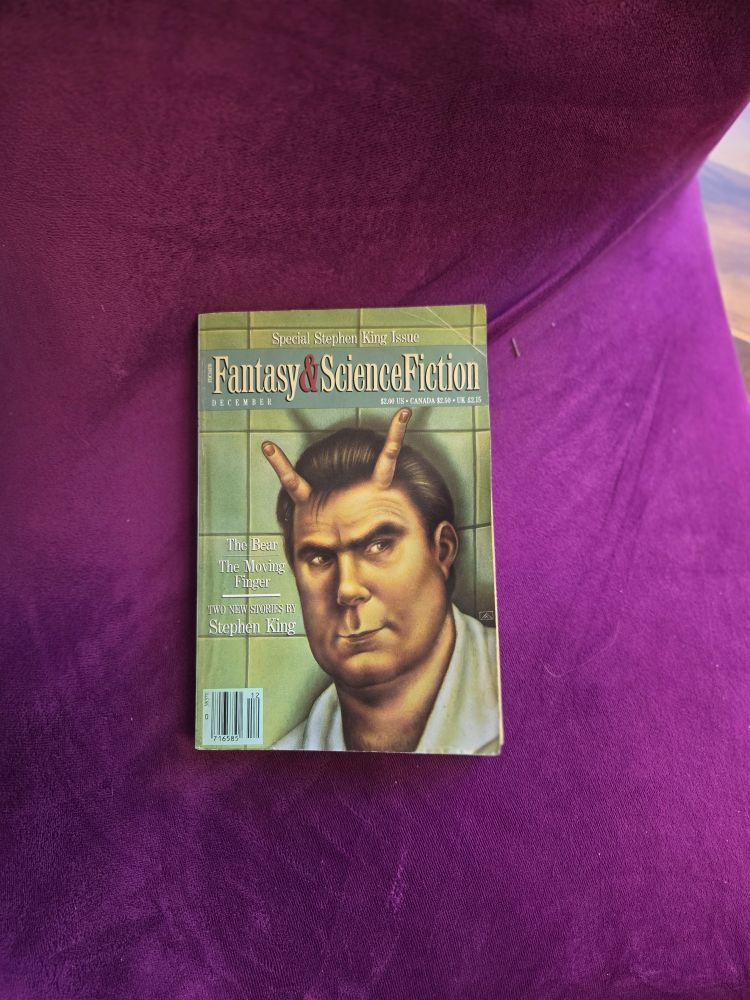 The front cover of a Stephen King special edition of Magazine of SF&F with a charciature of Stephen with horns that are fingers on the front. One of his stories in the book is 