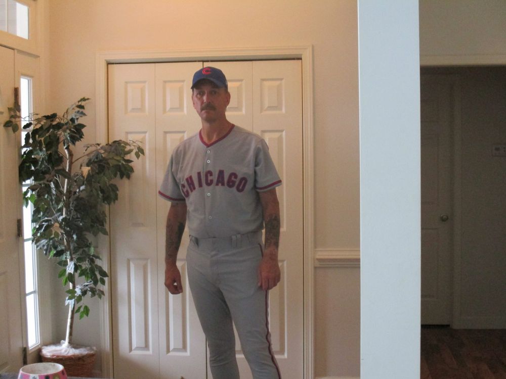 The author (It's ME) in a game-worn Chicago Cubs gray uniform, standing in front of our coat closet. I look just about ready to play.
