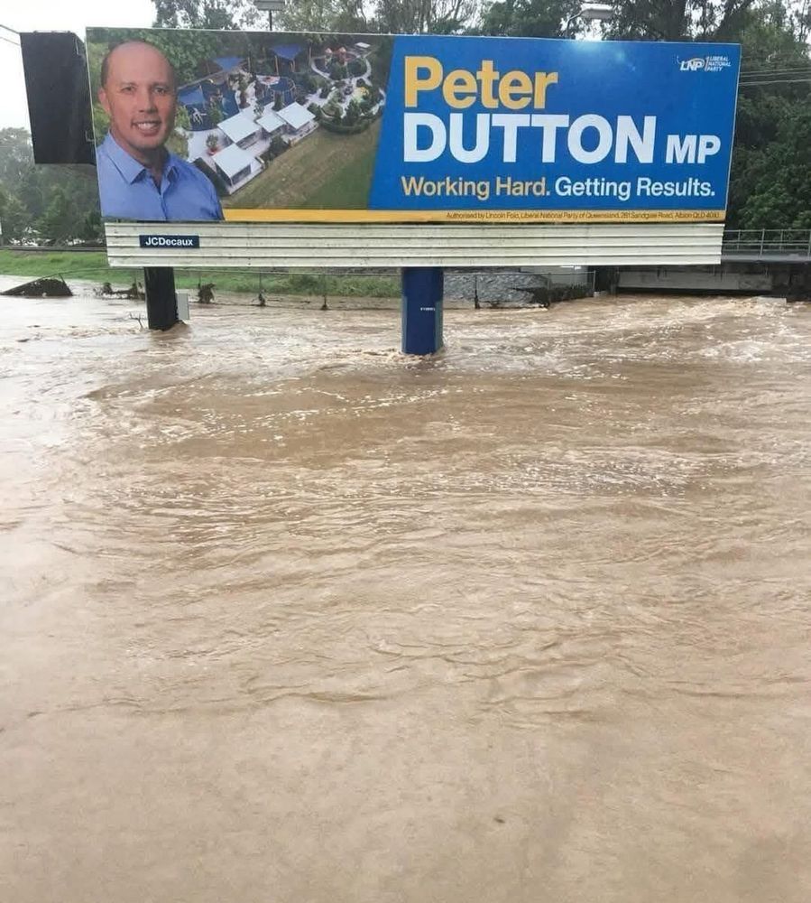 Peter Dutton electorate sign with flooding.