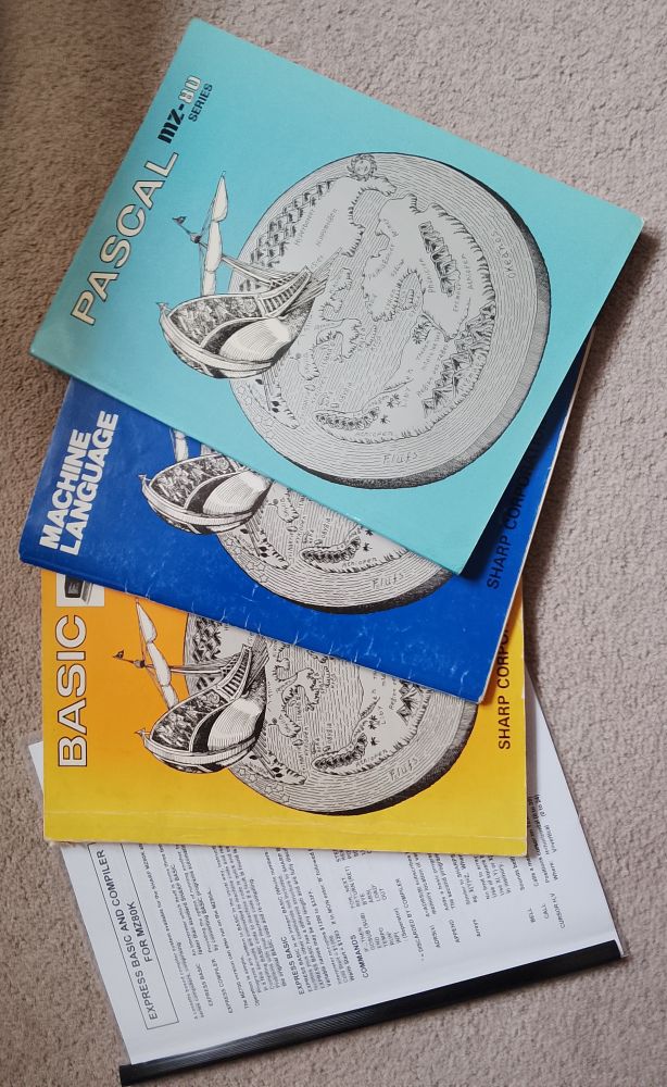 Four Sharp MZ-80K language manuals. Express BASIC, SP-5025 BASIC, Z80 Machine Language and Sharp Pascal.