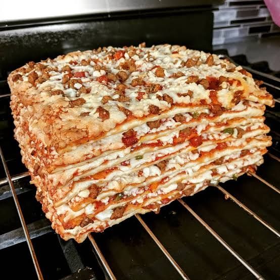 7 totinos pizza la stacked in an oven