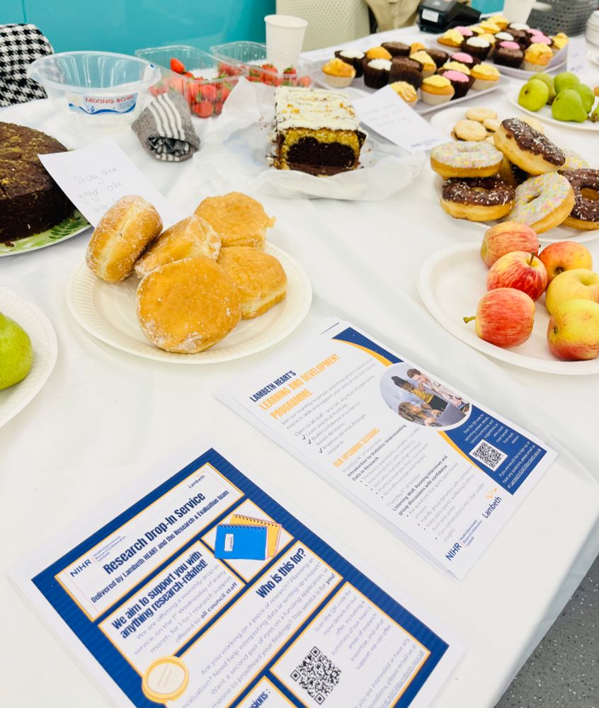 Image of table with cakes and leaflets 