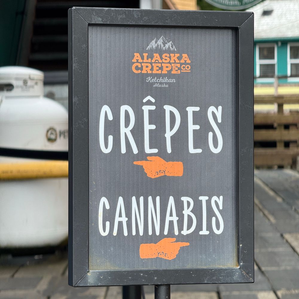 A sign that reads crepes or cannabis.