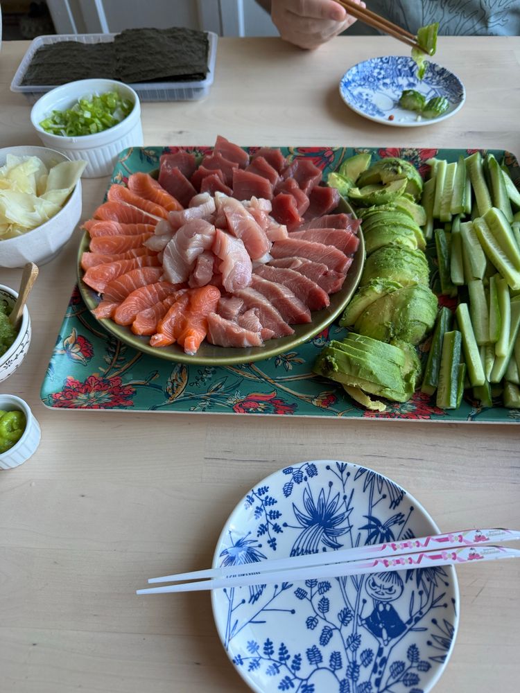 Plate of sashimi, avocado and cucumber 