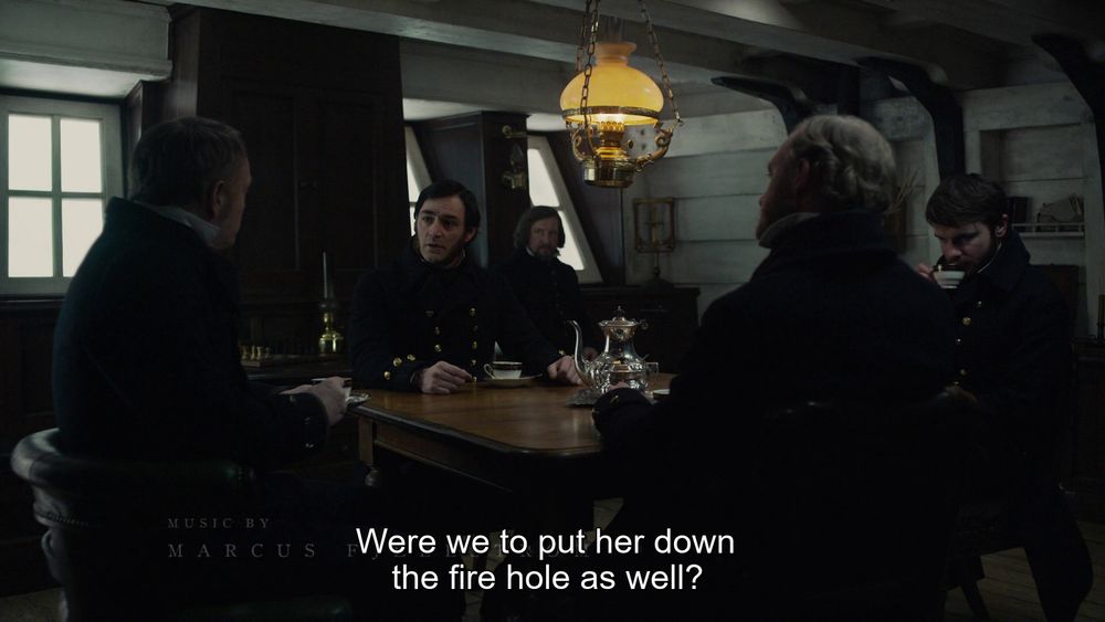The Terror, Episode 3 "The Ladder". Officers meeting aboard HMS Terror, Lt. Irving stares into space with a cup of tea in his hand. 