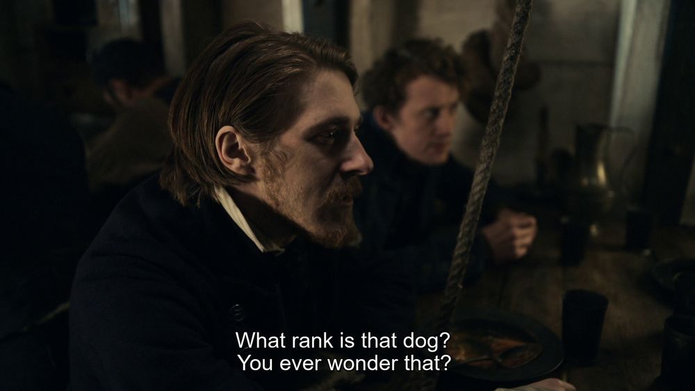 The Terror, Episode 1 "Go For Broke". Mr. Hickey starts to sow the seeds of mutiny. 
Pic 1: "What rank is that dog? You ever wonder that?"
PIc 2: "Puttin' a dog above a man. Who serves who in that arrangement?"