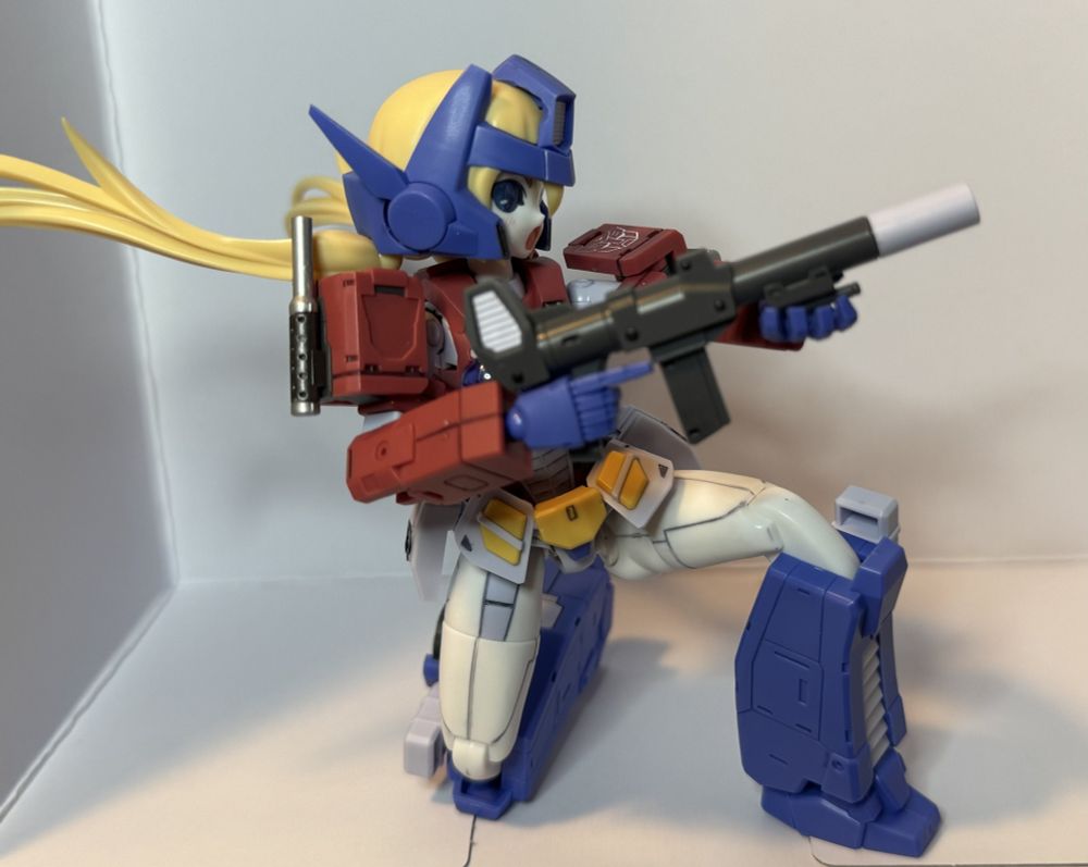 Side profile of kneeling with the rifle
