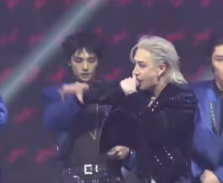 Another shot of Bang Chan on stage with his silver mullet