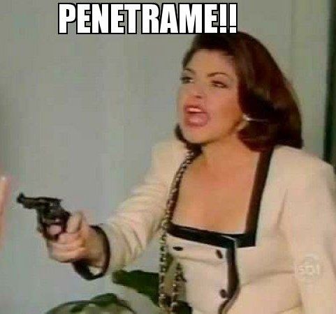 Screenshot from a telenovela with a woman aggressively pointing a gun at someone off camera captioned “penetrame!!”