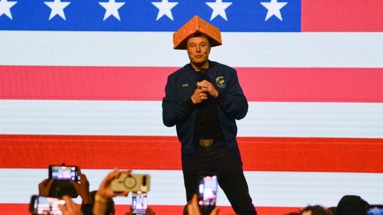 Elon Musk in Wisconsin wearing a "cheese hat"