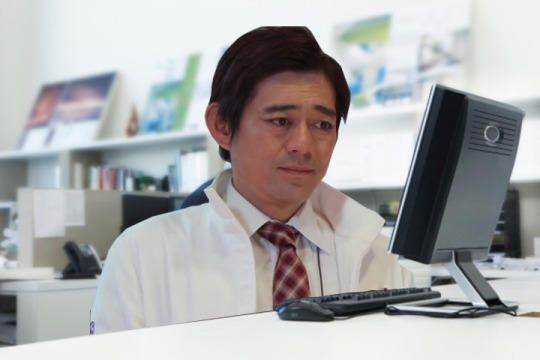 man looking upset at a computer screen