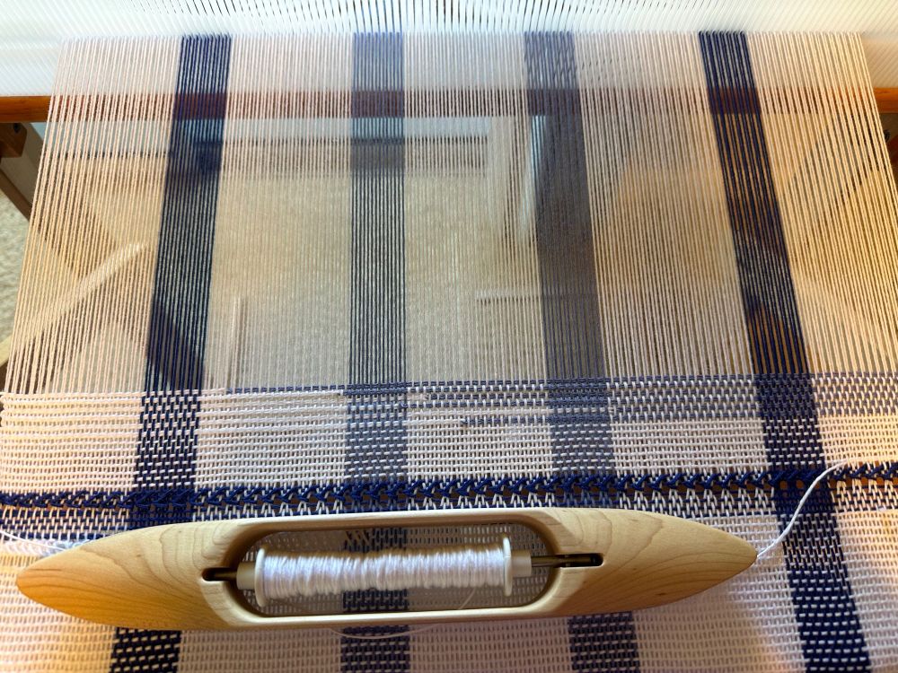 a handwoven project with clasped weft in use, allowing two colors to be used at once