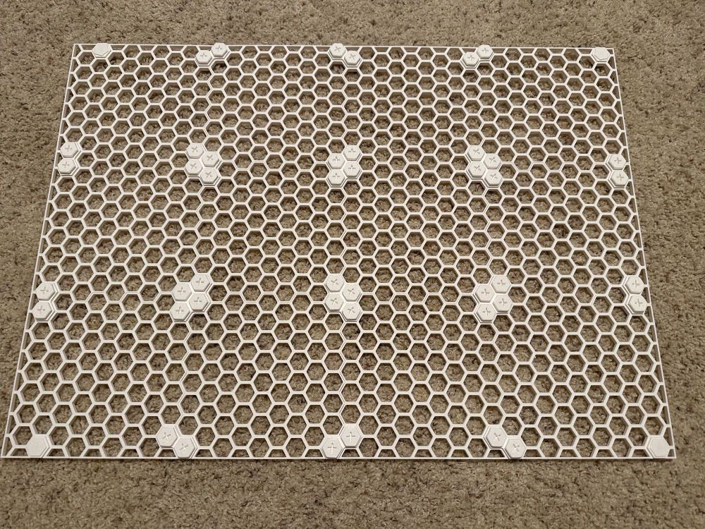 a 3d printed hexagonal grid laying on carpet