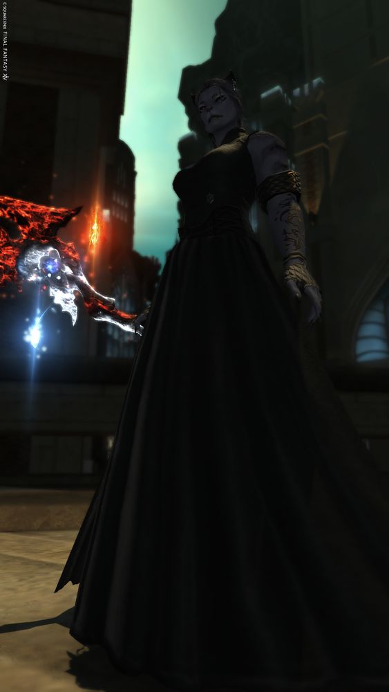 A portrait screenshot of a violet-furred female Black Mage Hrothgar wearing an elegant black dress amidst the streets of Amaurot