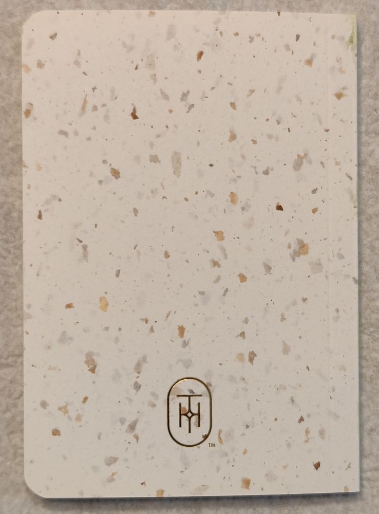 The back cover of a small notebook.