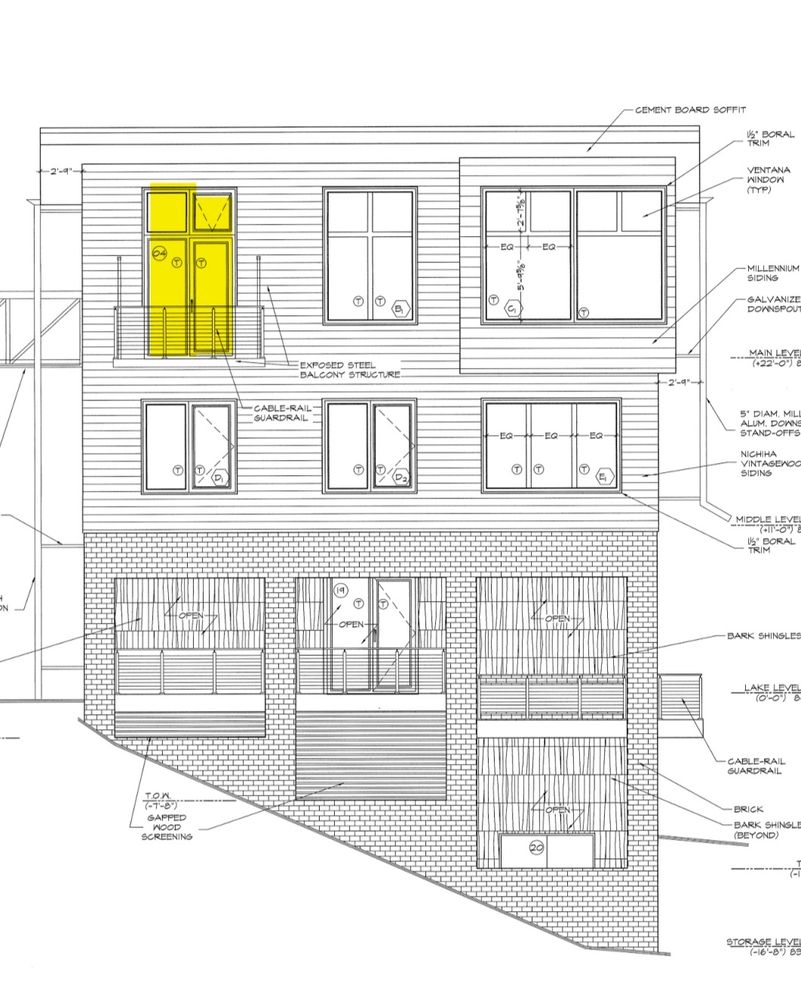 House elevations with a door and transom window highlighted. The transom window is currently specified to be an awning style window that will automatically open for makeup air. 
