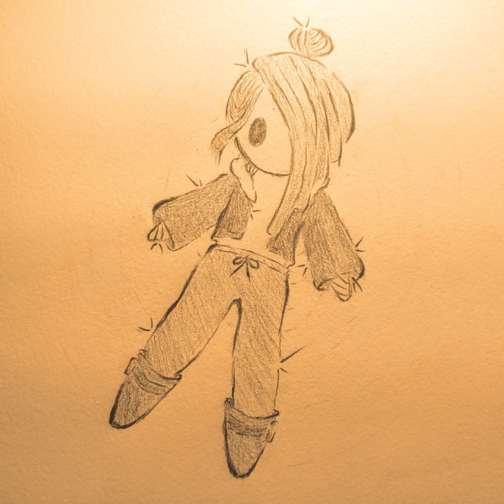 artwork of a small straw doll of xilos.bsky.social's oc, kira. they are wearing a brown cropped jacket, long pants tied at the waist, small boots, and a sleeveless turtleneck