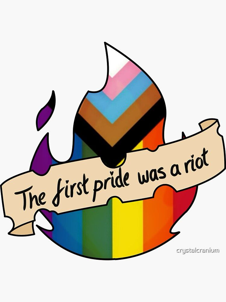 A progress pride flag in the shape of a flickering flame, with a scroll banner across the front which says “The first pride was a riot”. The tittle on the I in Pride is a tiny heart.
