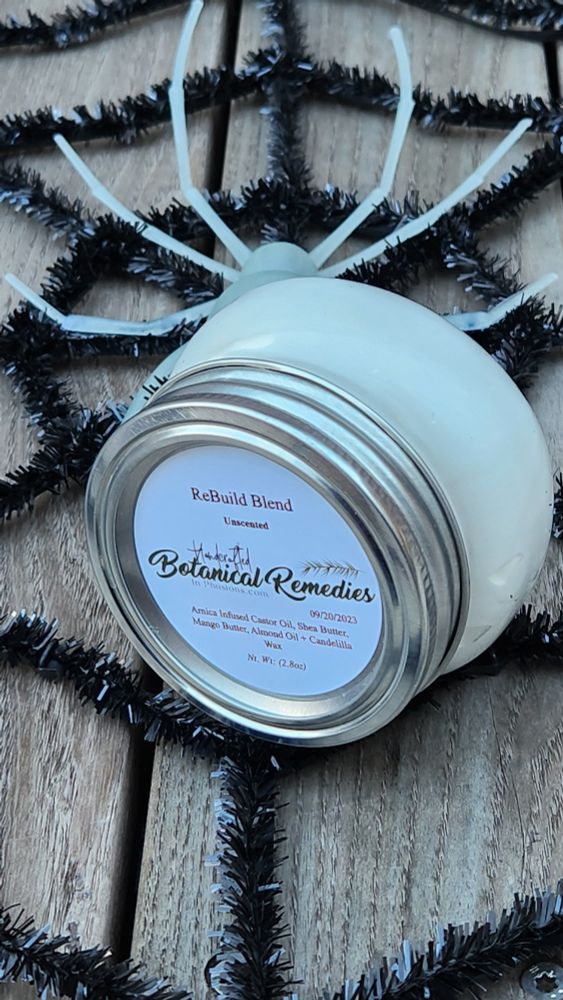 A round, 4 ounce, container of body
butter labeled "Rebuild Blend"
It is identified as an unscented
body butter. The
ingredients include castor oil, shea
butter, mango butter, almond oil and
candelilla wax.