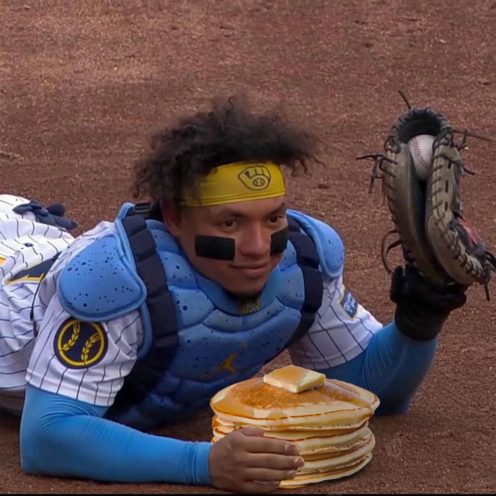 william contraries laying on the dirt after catching a baseball and pancakes 