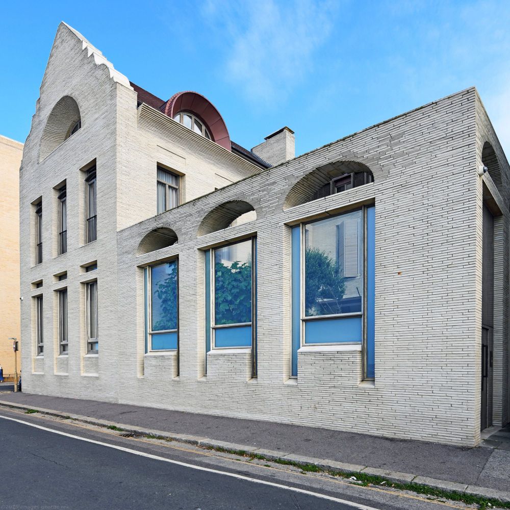 Photo of a seafront house built for for Polly Sampson and David Gilmour. The new house takes many cues from the original 1894 building designed by P.B.Chambers for the Hove Bath and Laundry Company. Currently for sale at just under £9M. Corner of King's Esplanade and Sussex Road, City of Brighton & Hove, UK. 