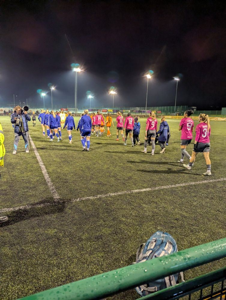 The referee leads the teams out before the FA Women's National League Northern Premier Division game between Rugby Borough and West Bromwich Albion at Kilsby Lane, Rugby.