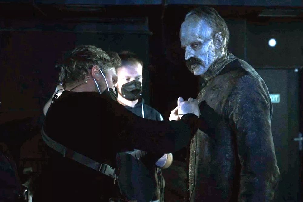 crew wearing respirators behind the scenes of nosferatu