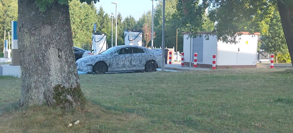 A picture taken at the Nürburgring, with in the center a prototype car by Mercedes AMG.
