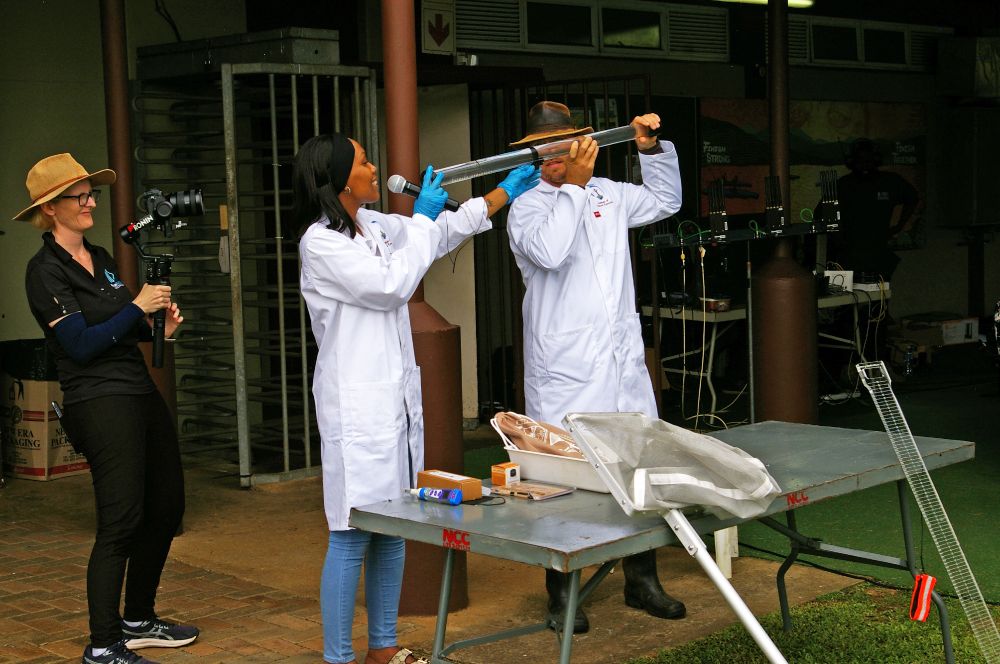 A colour image of three INR partners providing a demonstration of equipment available with the EnviroLab copyright INR