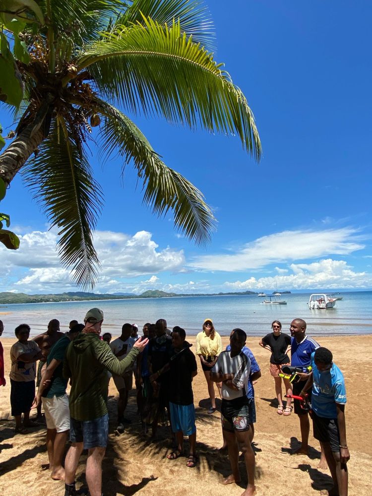 Attendees of a seagrass monitoring workshop receiving a final briefing before putting their new skill to the test (photo courtesy of Eirian Kettle)