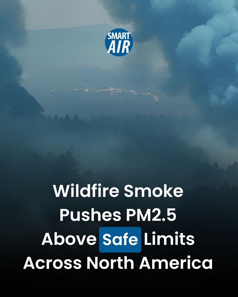 AI-generated image showing thick wildfire smoke covering a mountainous landscape with a distant city in the background. The "Smart Air" logo is displayed at the top center. Overlaid text reads: "Wildfire Smoke Pushes PM2.5 Above Safe Limits Across North America".