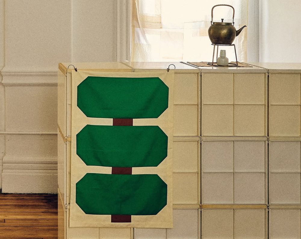 A bonsai like wall hanging of 3 extended octagonal panels in green 