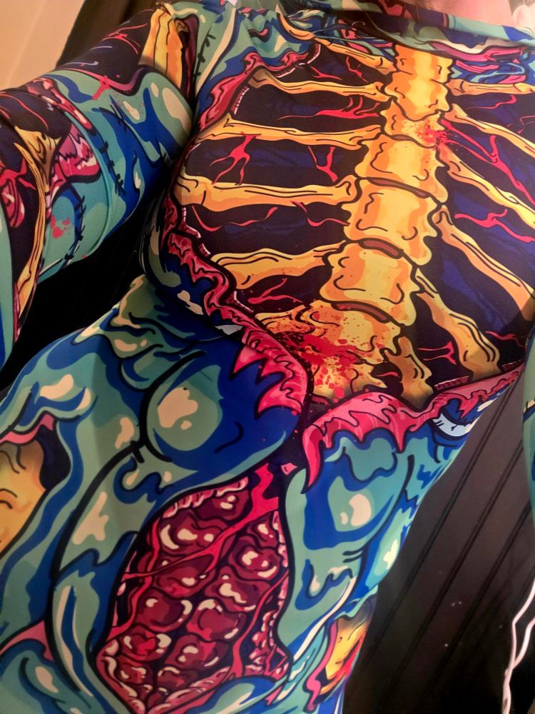 Close up of a colorful zombie flesh inspired bodysuit 