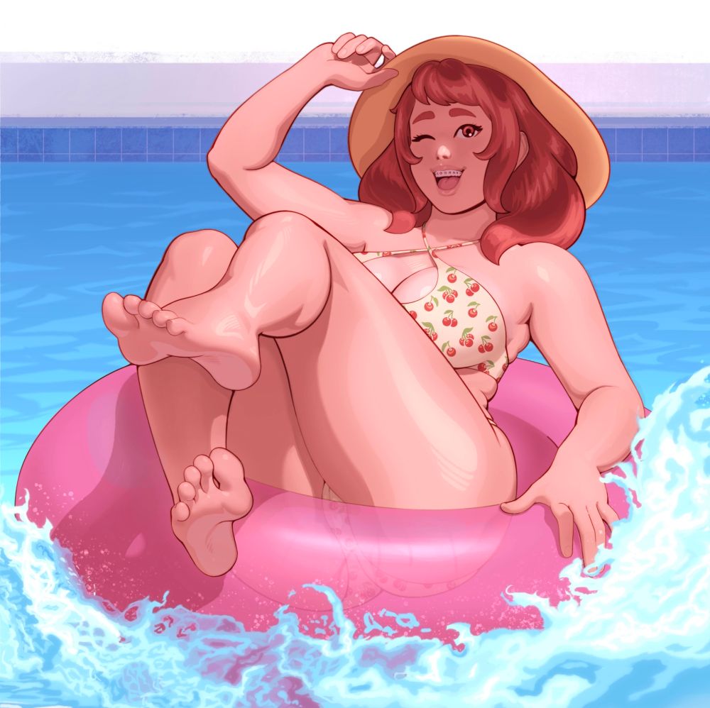 Cherry Fizz in a pink inner tube splashing into a pool. She wears a sun hat and a cherry print bikini.