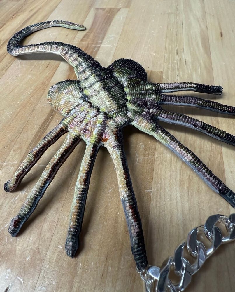 a fully beaded face hugger necklace pendant by jamie okuma