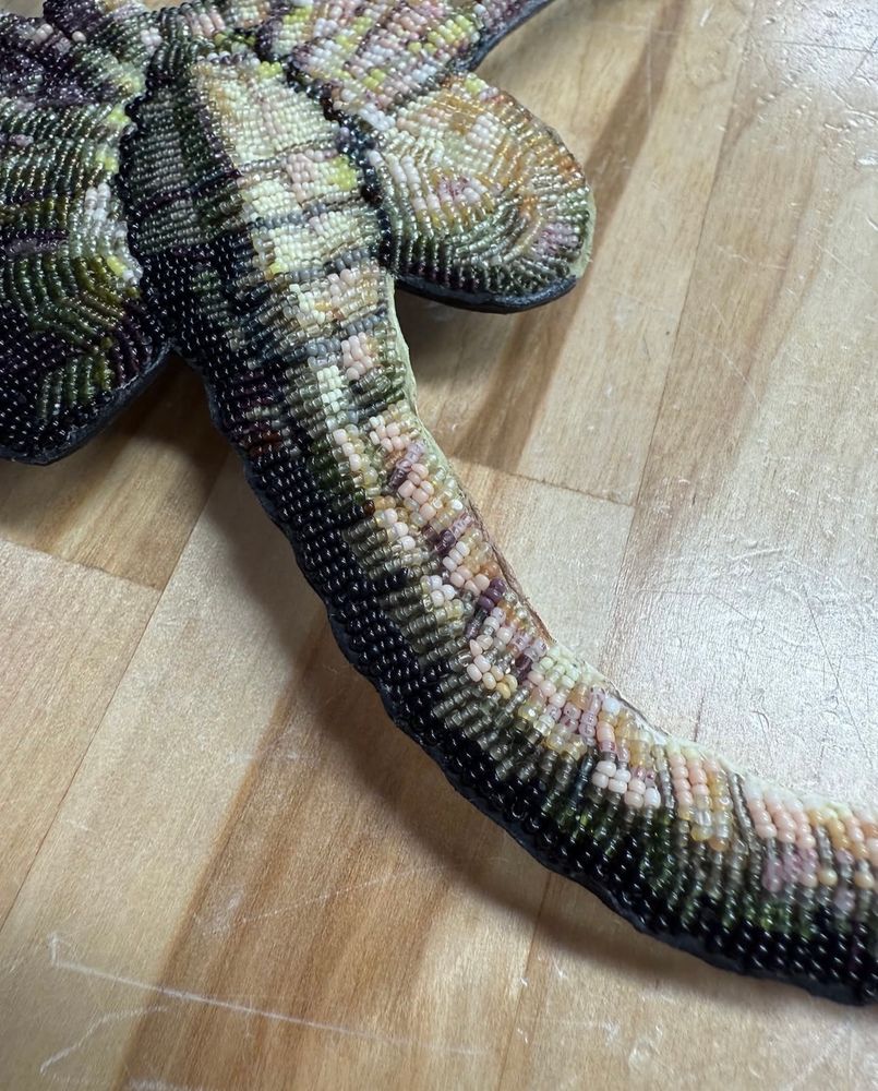 a fully beaded face hugger necklace pendant by jamie okuma