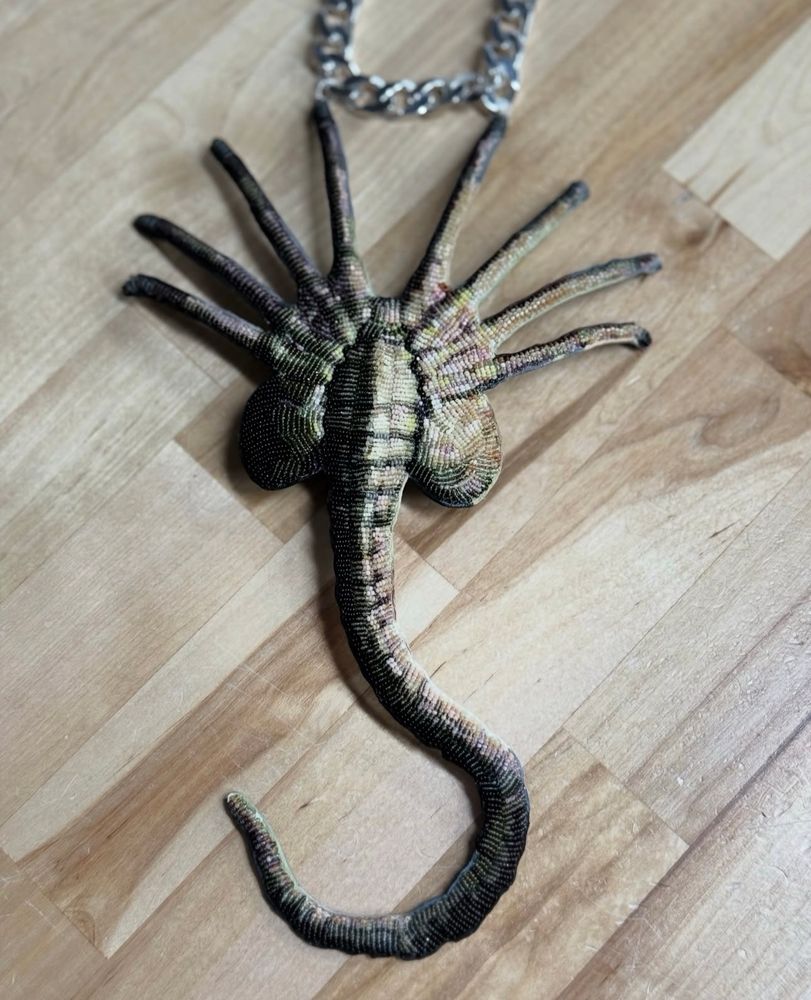a fully beaded face hugger necklace pendant by jamie okuma