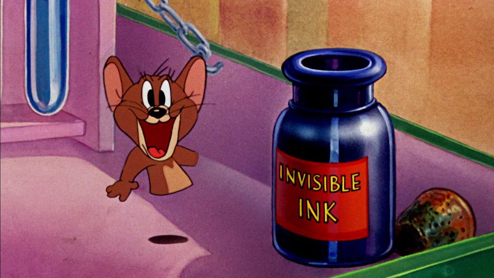 Jerry smiles next to the invisible ink with his lower half and left hand invisible.