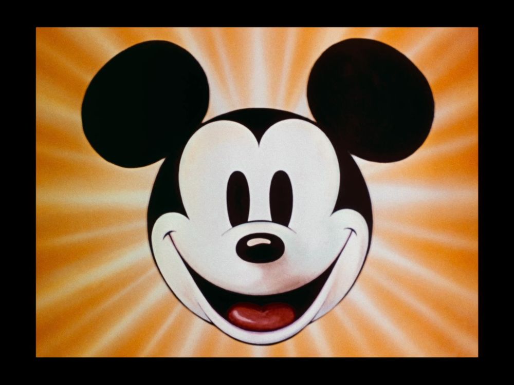 The giant, radiant face of Mickey that appeared at the start of his cartoons.