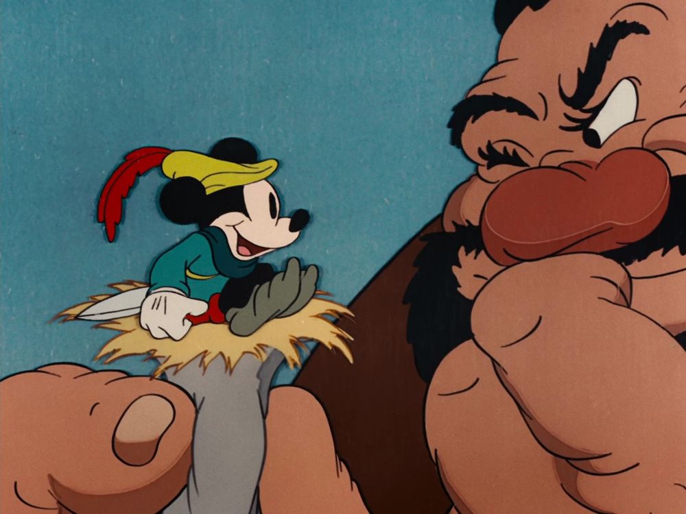 A giant eyes the little tailor (Mickey Mouse).