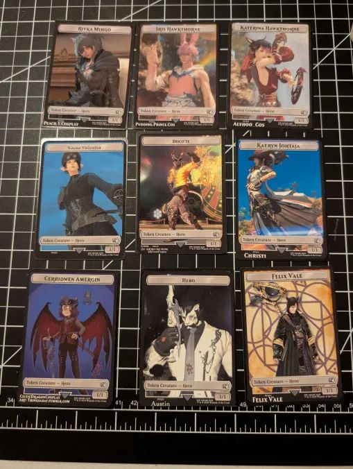 First attempt at making Magic the gathering warrior of light hero tokens. Nine tokens of various players are shown in a 3 by 3 grid pattern