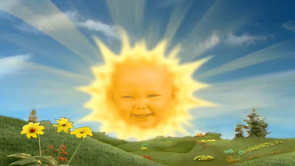 a cartoon sun with a baby 's face in it