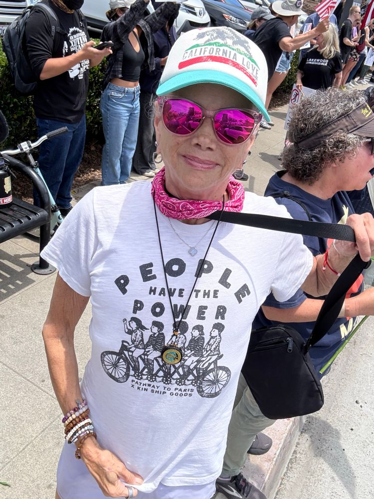Women wearing shirt, “People Have the Power”