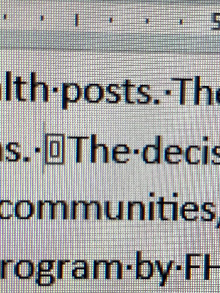 Character in Word document that looks like a small square with a larger square around it. 
