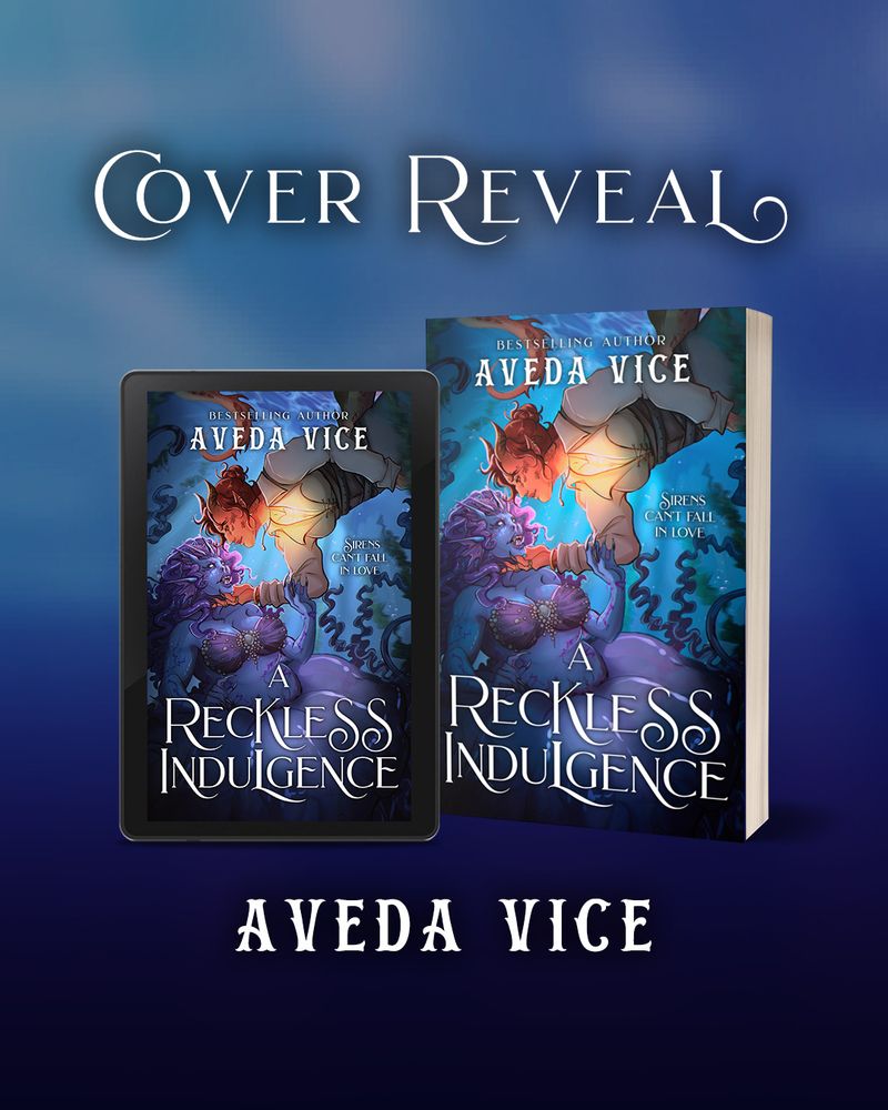 A blue, watery background with the book "A Reckless Indulgence" on a tablet and in paperback form.

The cover shows an underwater scene. A reddish, non-binary half-dragon is diving down with his hand outstretched. His chest (where he has breasts) is glowing. He is cupping the face of a ferocious-looking purple/blue mermaid with a jellyfish tail. She looks startled.