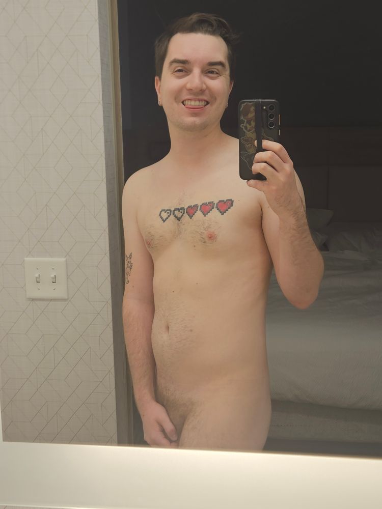 Me in a hotel bathroom about to shower 