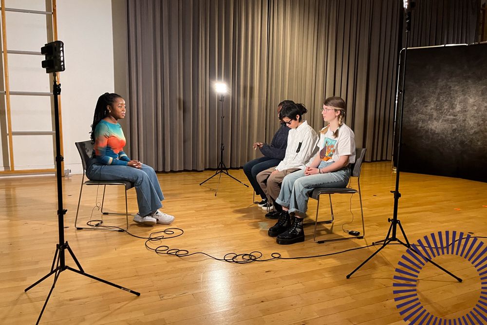 A TV presenter interviews three young disabled and non-disabled musicians.