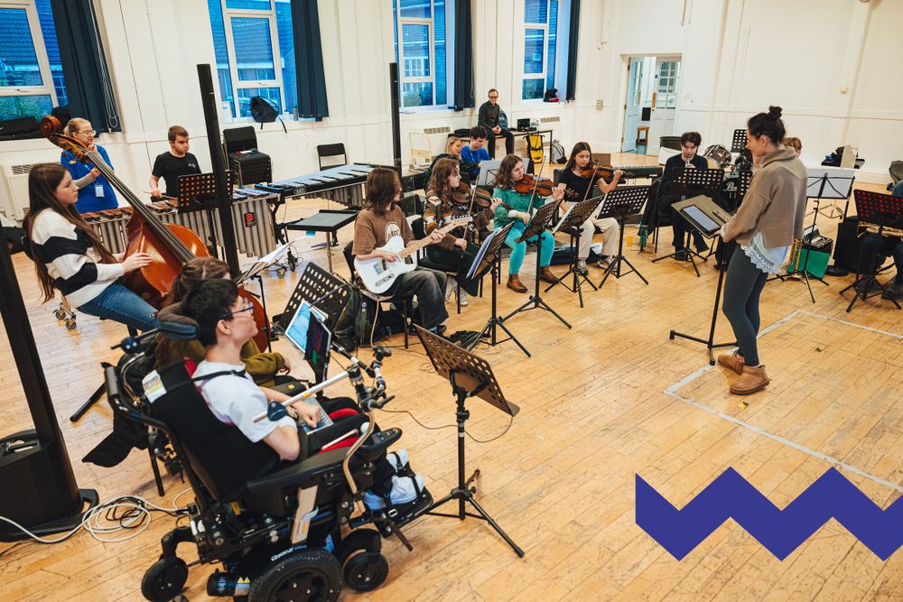 A group of young disabled and non-disabled musicians rehearse together on acoustic, electronic and accessible instruments.