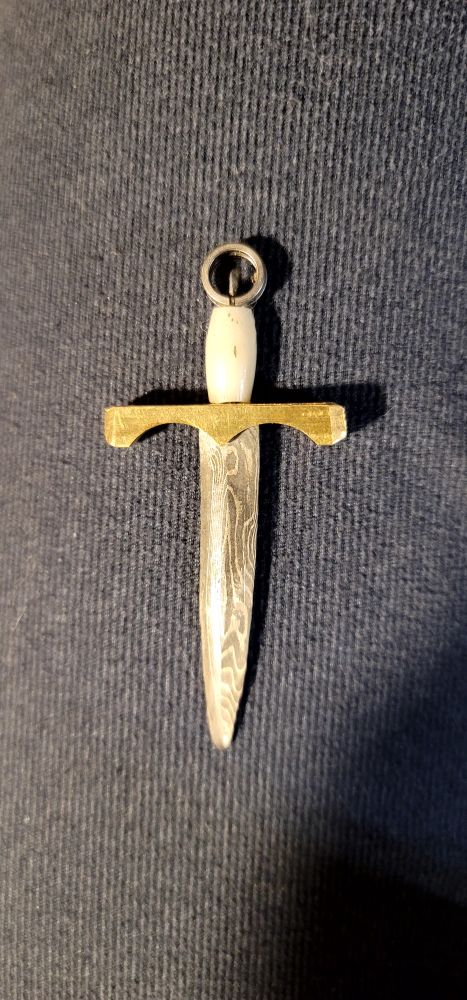 2:53 replica of a Gaelic style ring-pommel sword in Damascus steel, brass, bone, and titanium. 